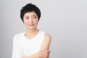 Asian woman with textured, cropped dark hair